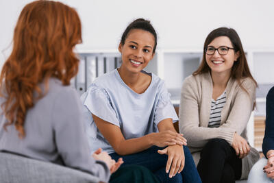 Women with problems sitting together during counseling - social work