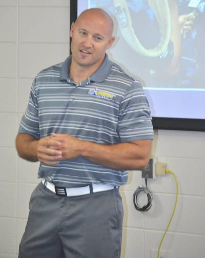 New Football Coach Speaks To President's Advisory Council
