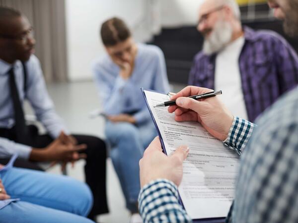 Closeup of Psychologist in Support Group - social work