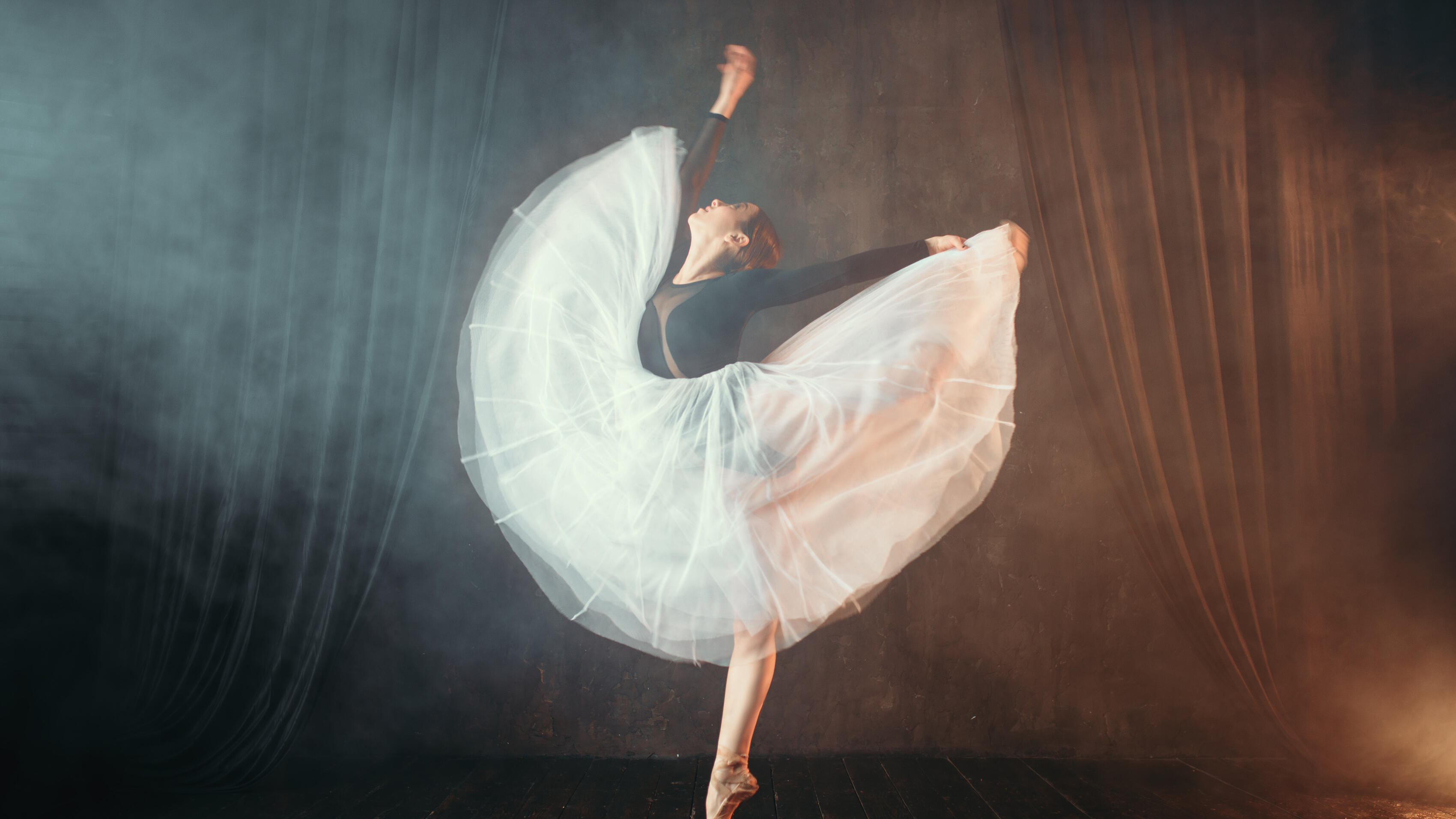 Ballet dancer in motion on the stage in theatre