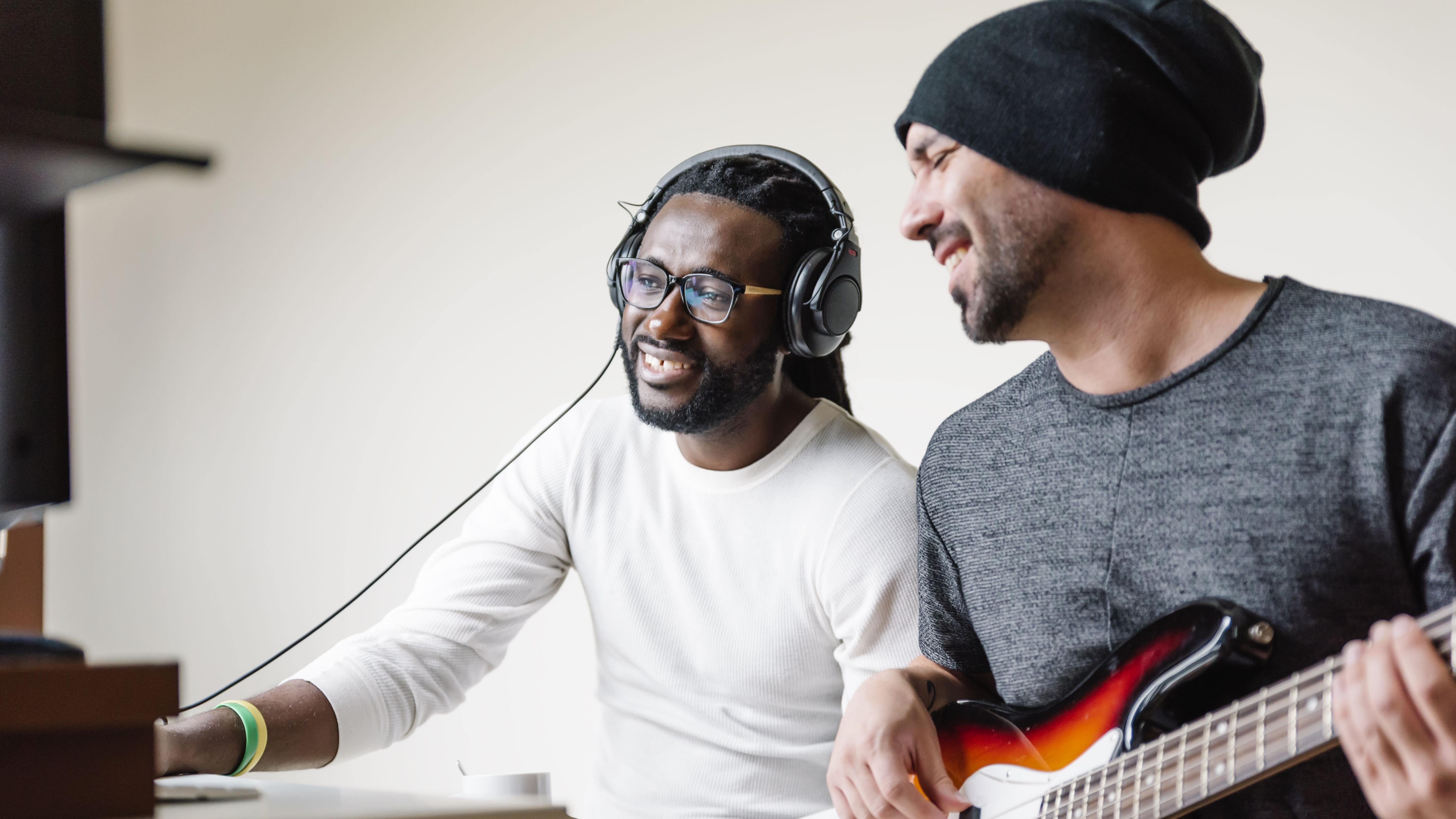 Artists producing music in their home sound studio