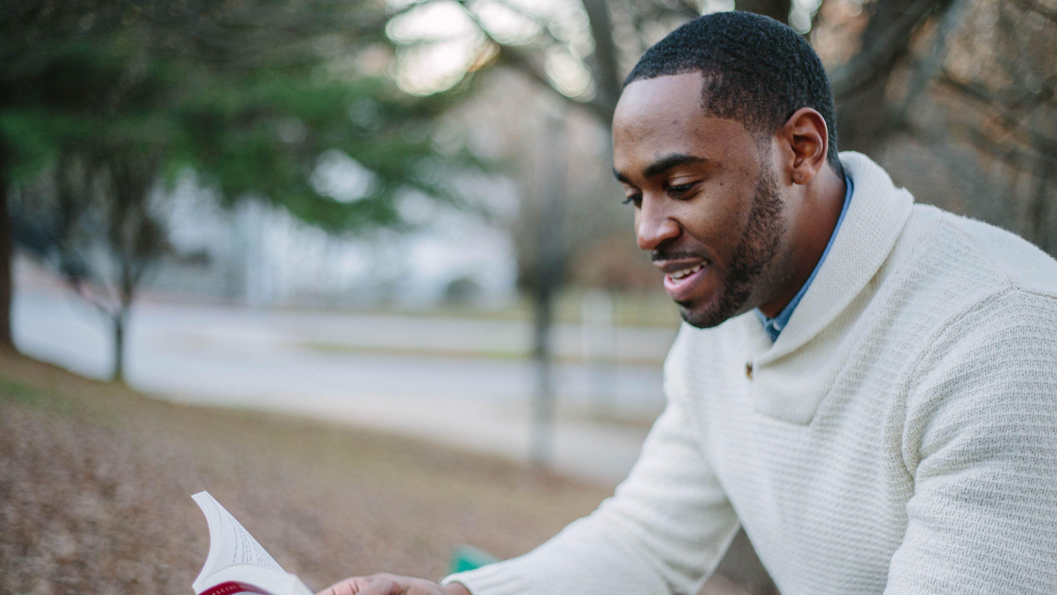 young man reading book