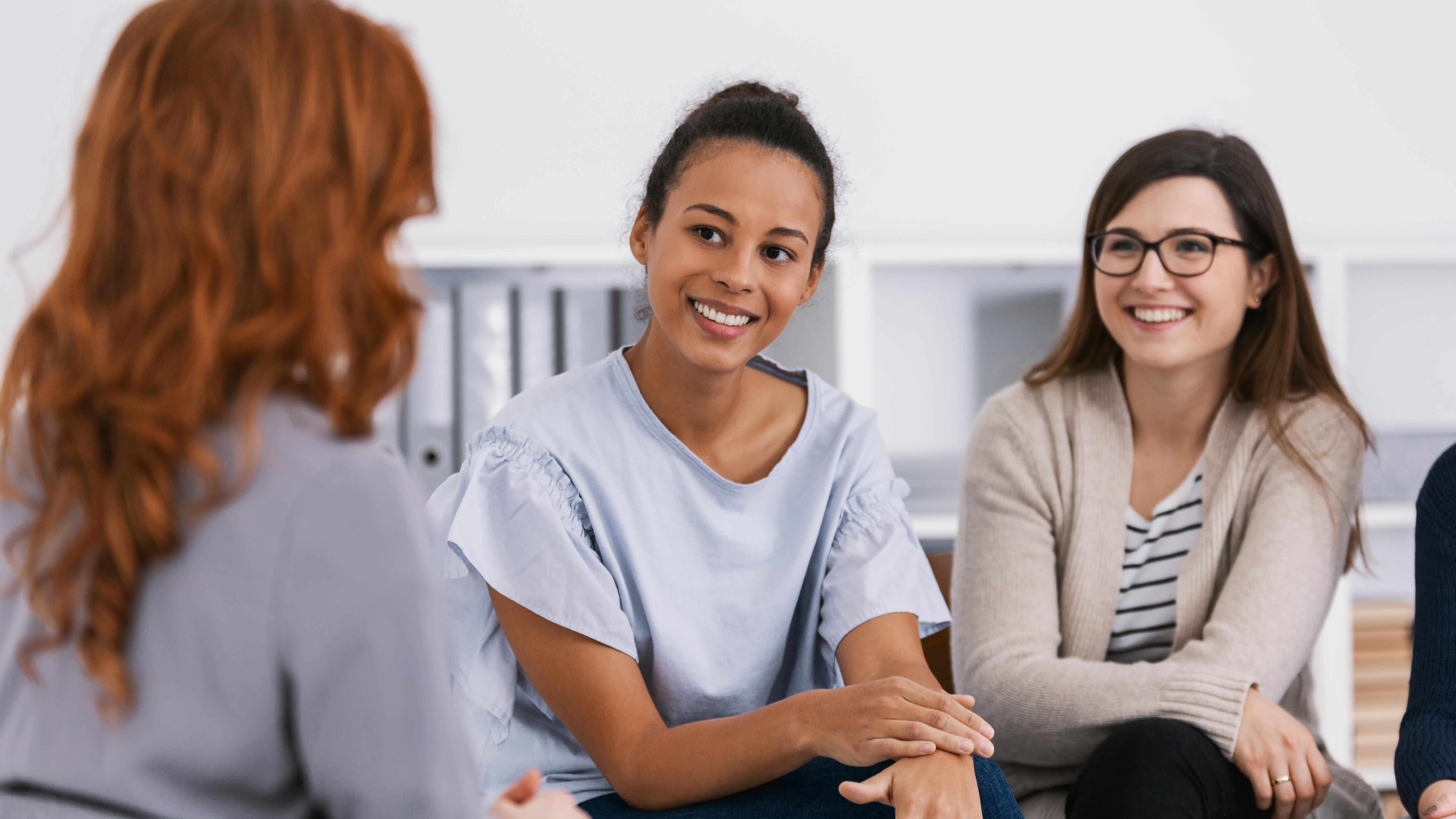 Women with problems sitting together during counseling - social work