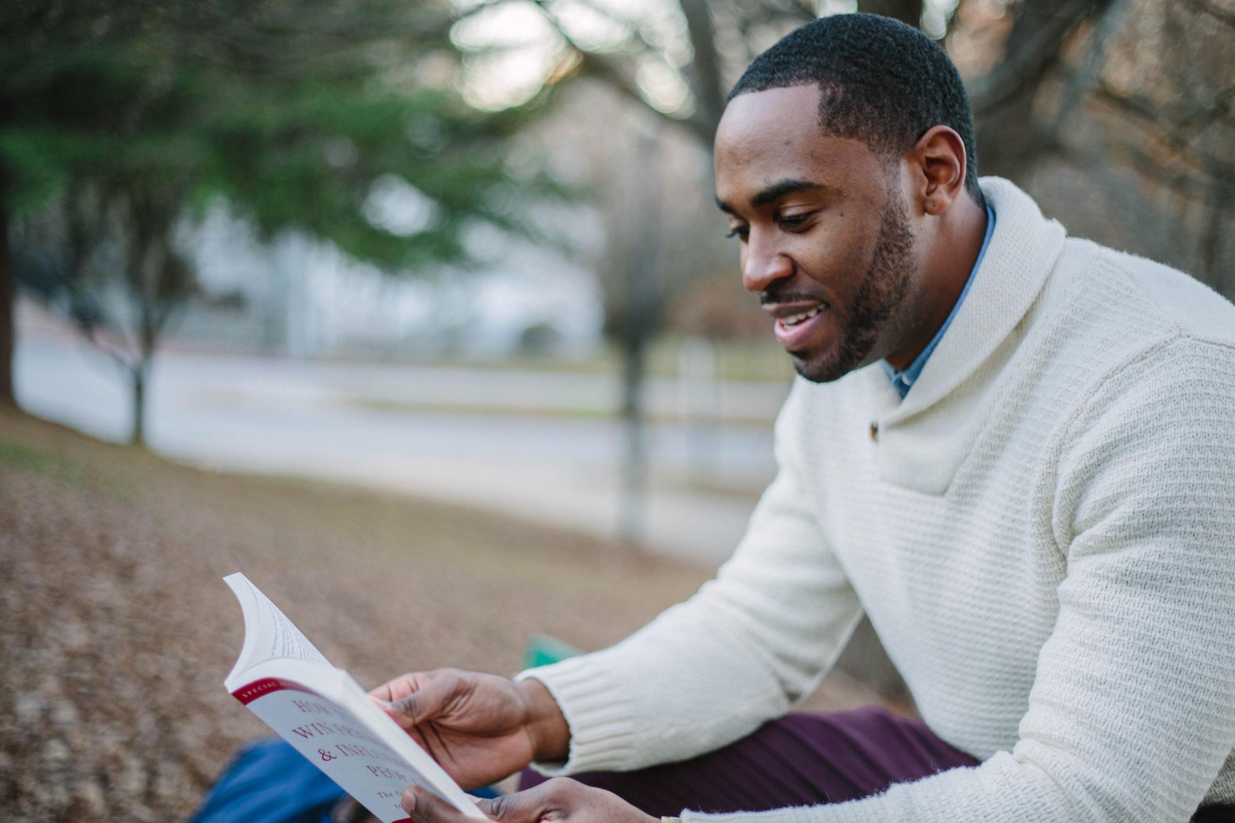 young man reading book